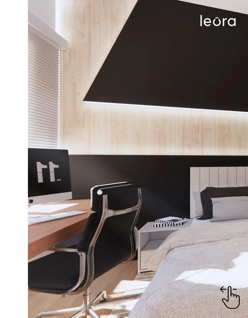 Bedroom with a black desk under the window and a dark panelled headboard wall